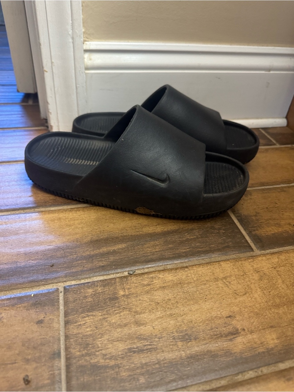 Nike Calm Black Slide Sandals with Embossed Swoosh